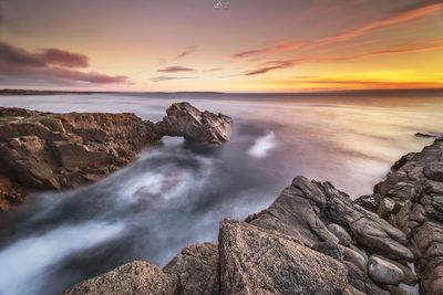 Scenic view of sea against sky during sunset
