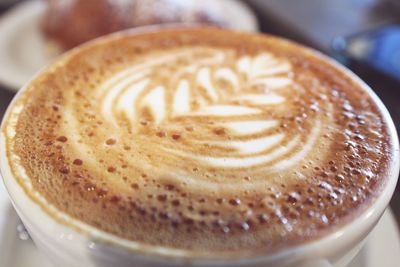 Close-up of cappuccino on table