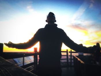 Low angle view of silhouette man against sky during sunset