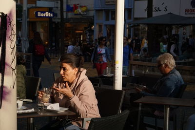 People sitting in restaurant at cafe
