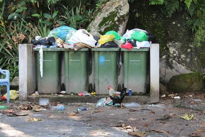 Garbage bin against built structure