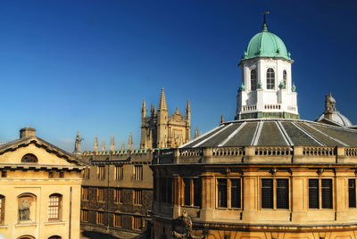 Low angle view of building against blue sky