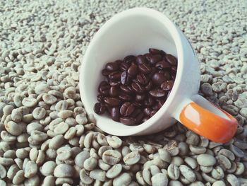 Close-up of roasted coffee beans in cup