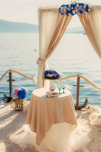 Scenic view of beach by sea against clear sky