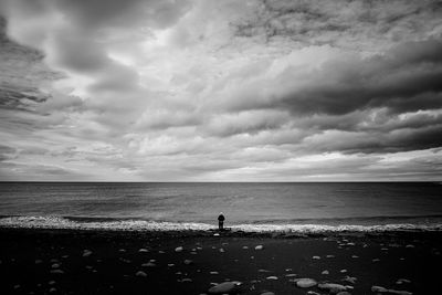 Scenic view of sea against cloudy sky