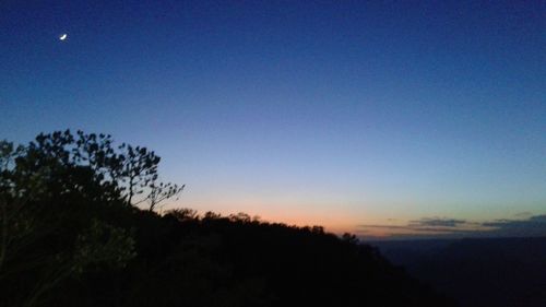 Scenic view of landscape against blue sky