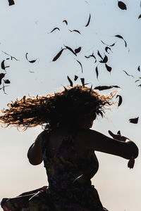 Low angle view of trees in front of sky