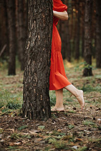 Peace of mind, breathing fresh air. alone woman in red dress enjoys the tranquility and calm