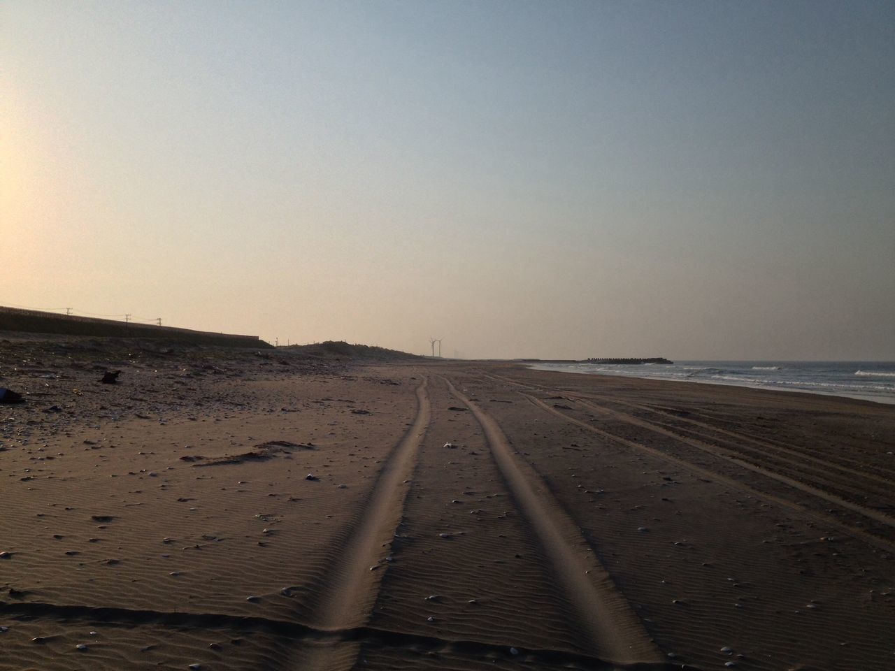 sea, beach, water, horizon over water, sand, tranquil scene, clear sky, tranquility, shore, the way forward, scenics, copy space, nature, beauty in nature, sky, diminishing perspective, coastline, outdoors, idyllic, vanishing point