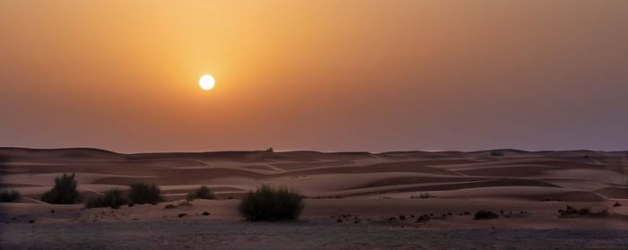 Scenic view of landscape against sky during sunset