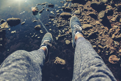 Low section of man legs on rock