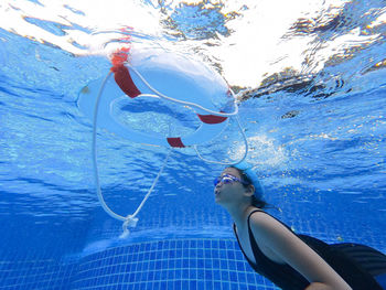 Woman swimming in sea
