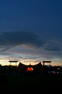 Silhouette of built structure against sky at sunset