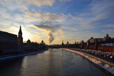 View of bridge over river against cloudy sky