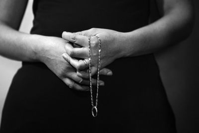 Close-up of cropped woman holding hands