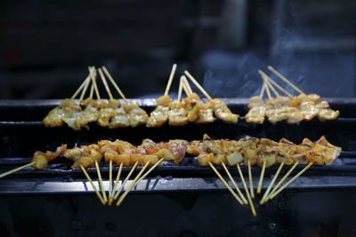 Close-up of meat on barbecue grill