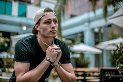 Portrait of young man looking away