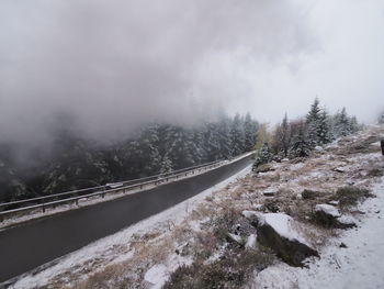 Scenic view of snow covered mountains against sky