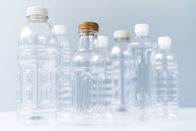 Close-up of wine bottles on table