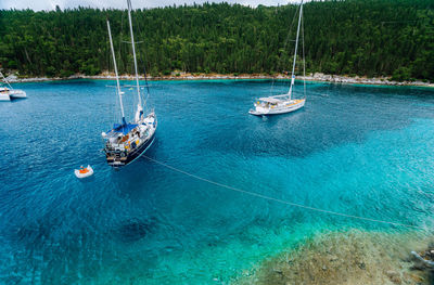 High angle view of sailboats on sea