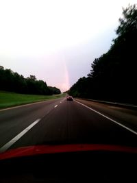 Road passing through forest