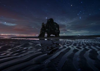 Scenic view of sea against sky at night