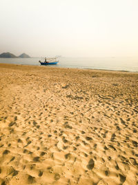 Scenic view of beach against clear sky