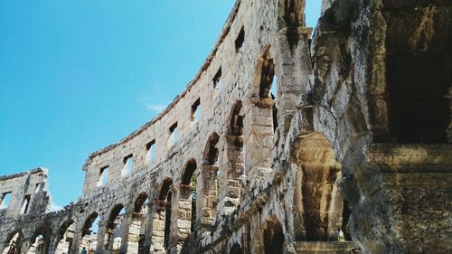 Low angle view of pula arena against sky