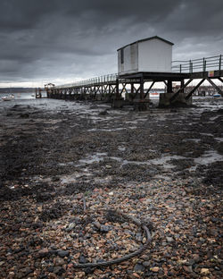 Pier over sea against sky