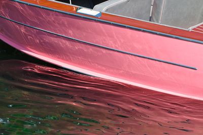 High angle view of multi colored boat moored in sea