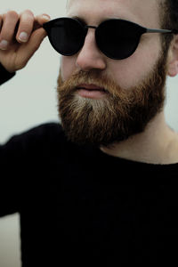 Close-up of young man wearing sunglasses