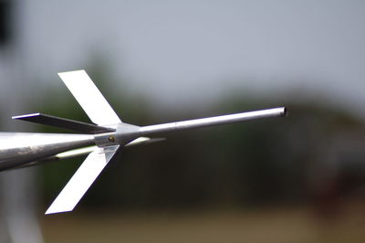 Close-up of wind turbine against sky