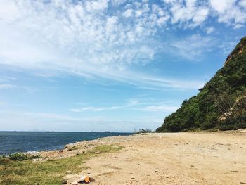 Scenic view of beach against sky