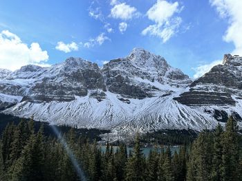 Scenic view of snowcapped mountains against sky