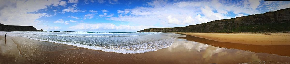 Panoramic view of beach against sky