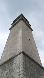 Low angle view of clock tower against sky