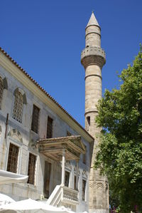 Low angle view of historic building against clear blue sky at kos island