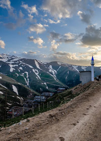 Scenic view of snowcapped mountains against sky
