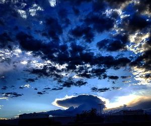 Clouds over city at sunset