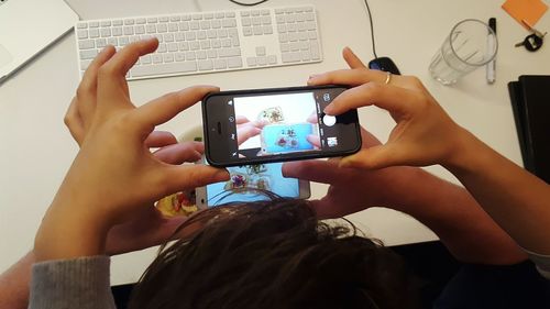 Midsection of man using mobile phone