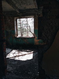 Damaged window in abandoned building