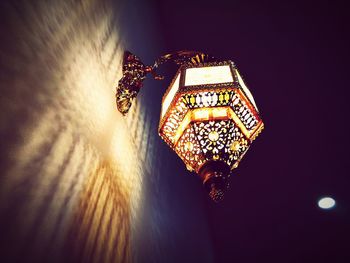 Low angle view of illuminated lamp