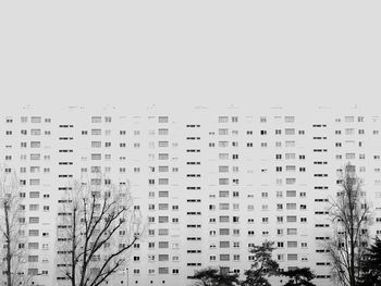 Low angle view of skyscrapers against clear sky