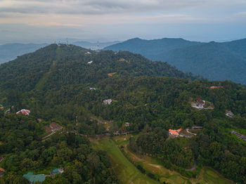 High angle view of trees and buildings against sky