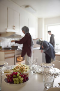 Family preparing eid al-fitr together at home