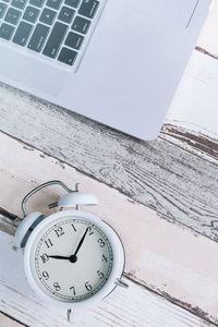 High angle view of clock on table