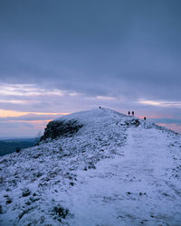 Snowy sunset at the skirrid, brecon beacons 