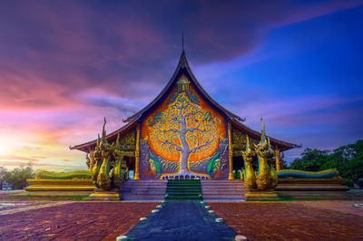 Wat phuproud magical glow at sunset. ubon ratchathani province,thailand