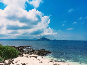 Scenic view of sea against cloudy sky