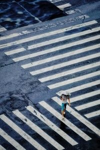 High angle view of person crossing road